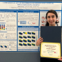 Kosar Rahimi, a Ph.D. candidate in the Chemical and Biomolecular Engineering Department, poses with her award in front of her poster.